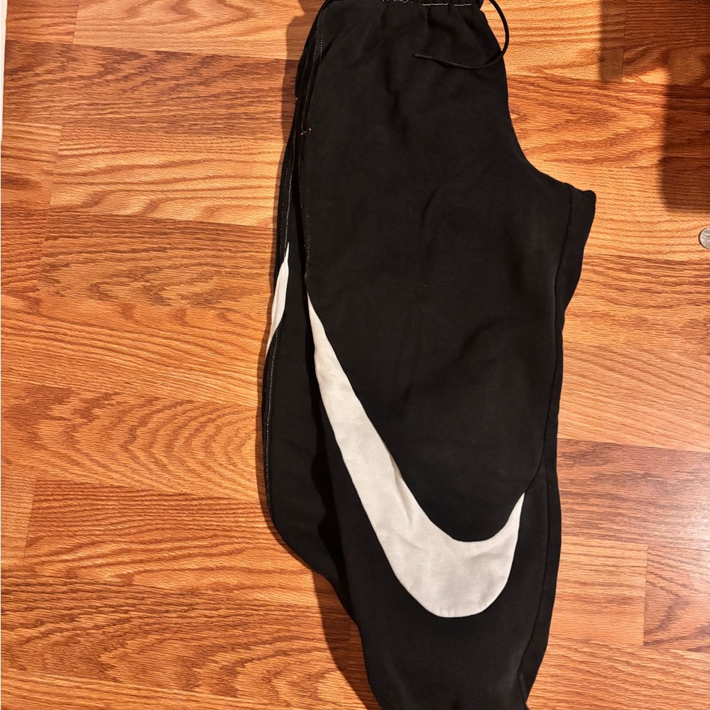 Black Nike Joggers with White Swoosh